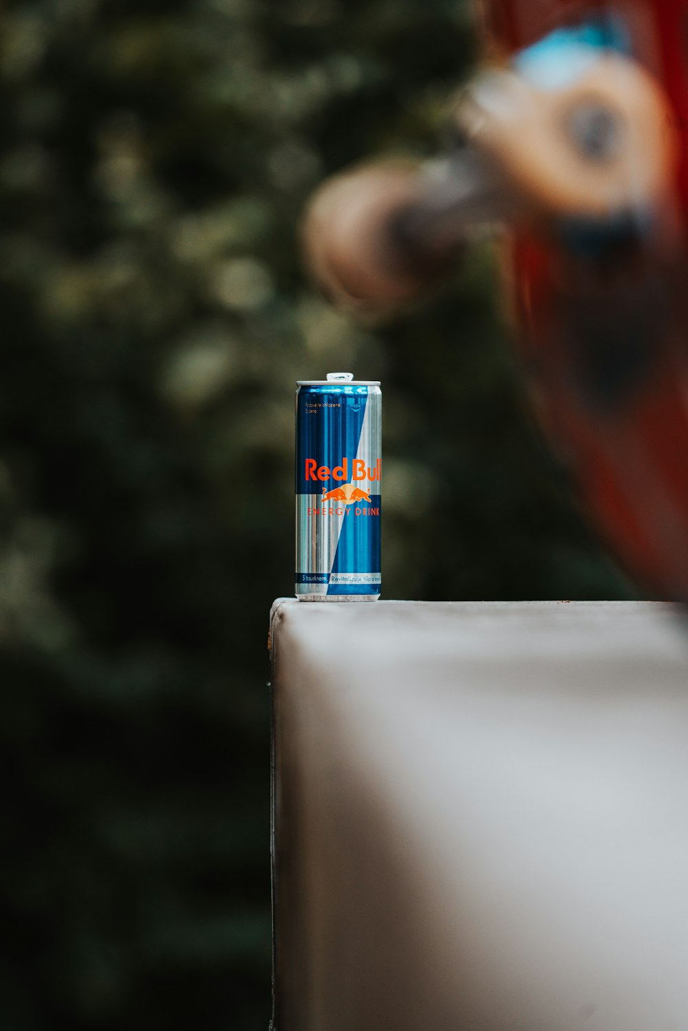 a can of soda sitting on top of a table