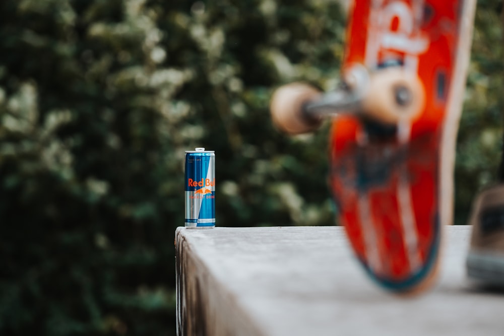 a close up of a skateboard and a lighter