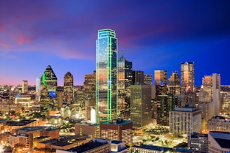a view of a city at night from the top of a building