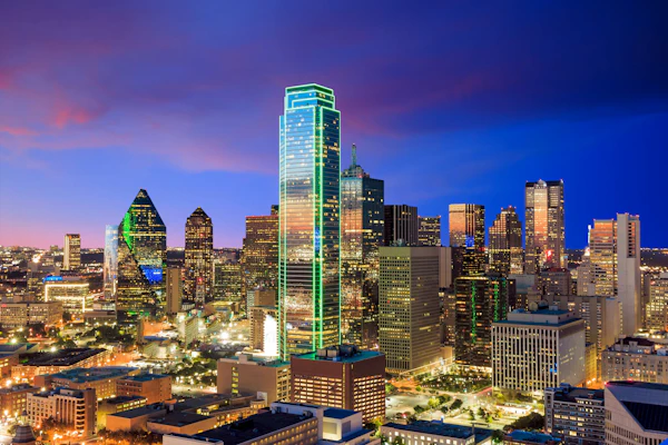 The Dallas skyline lit up at dusk