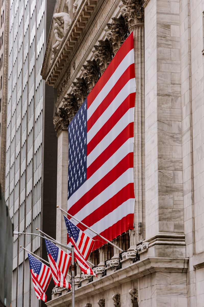 New York Stock Exchange building facade with American flag
