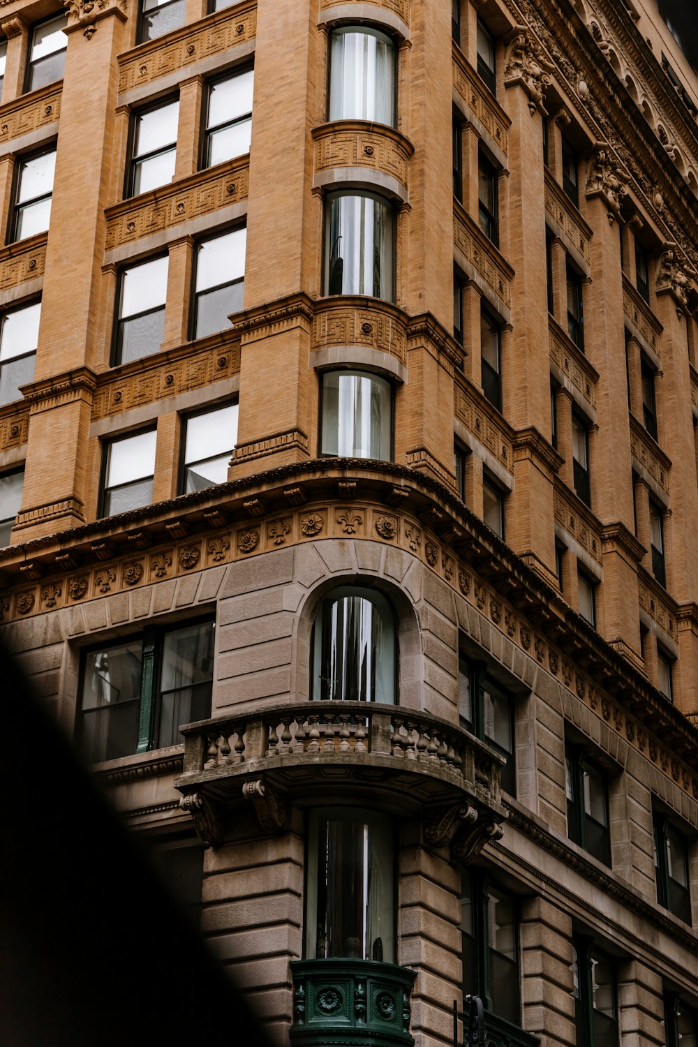 a tall building with a clock on the front of it