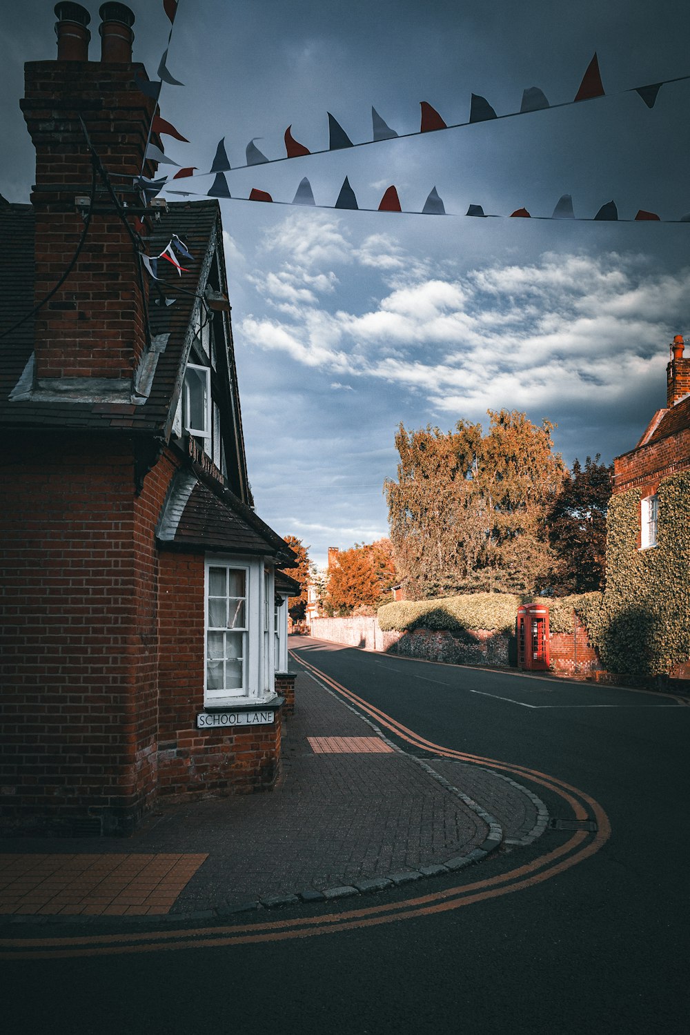 a street with a red brick building on the side of it