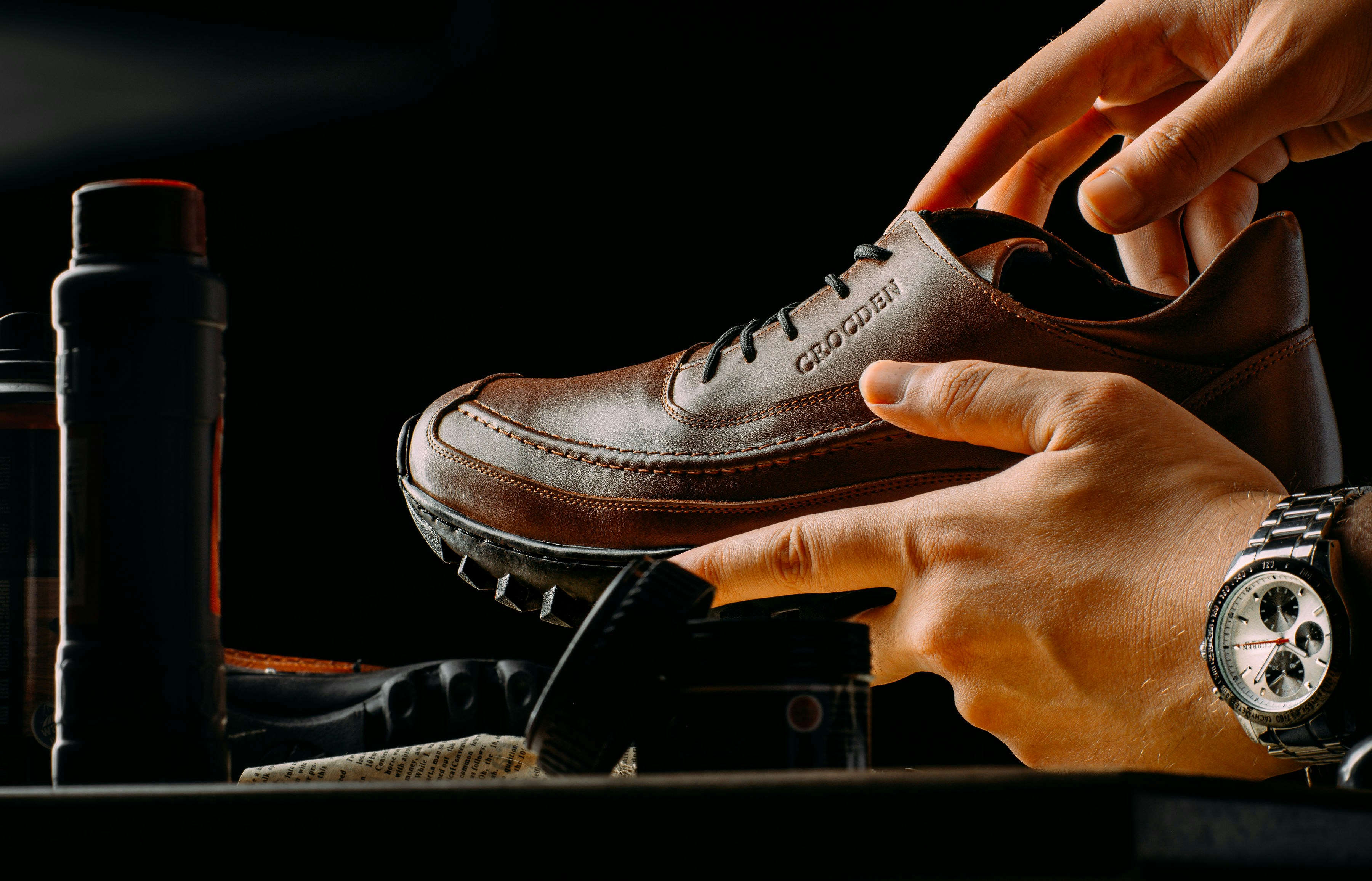 Shoemaker crafting a leather shoe