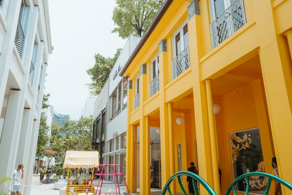 a couple of yellow buildings sitting next to each other