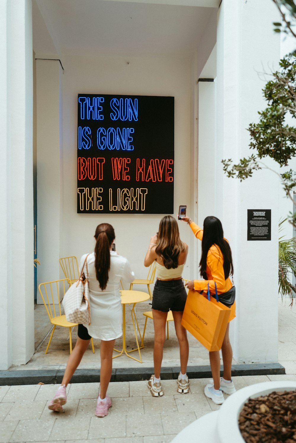 a group of women standing next to each other