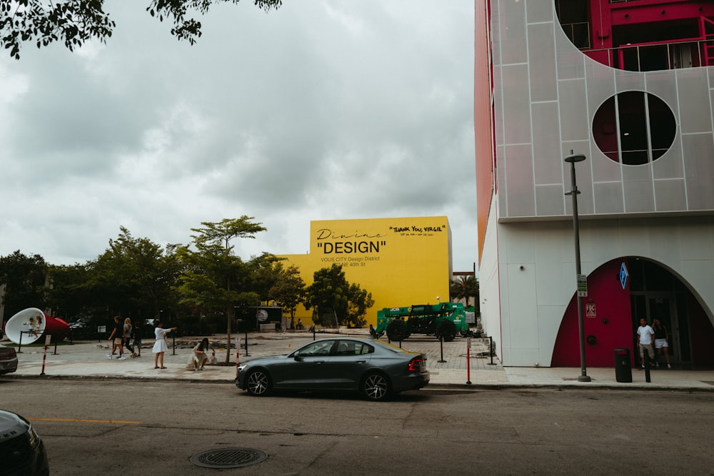 a car is parked in front of a building