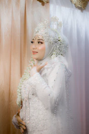 Elegant bride wearing a handmade Oaxacan wedding dress with intricate embroidery.