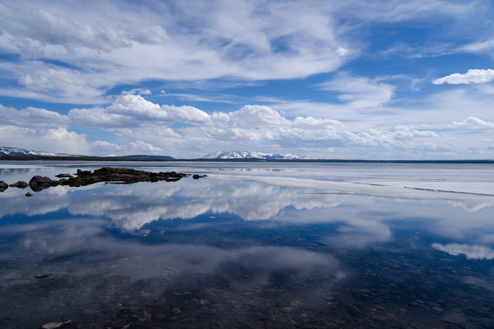 a large body of water with rocks in it