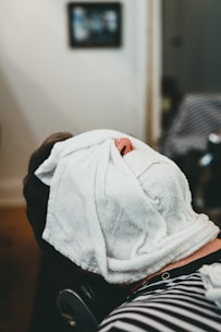 a person with a towel on their head
