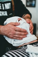 a man getting his hair cut by a barber