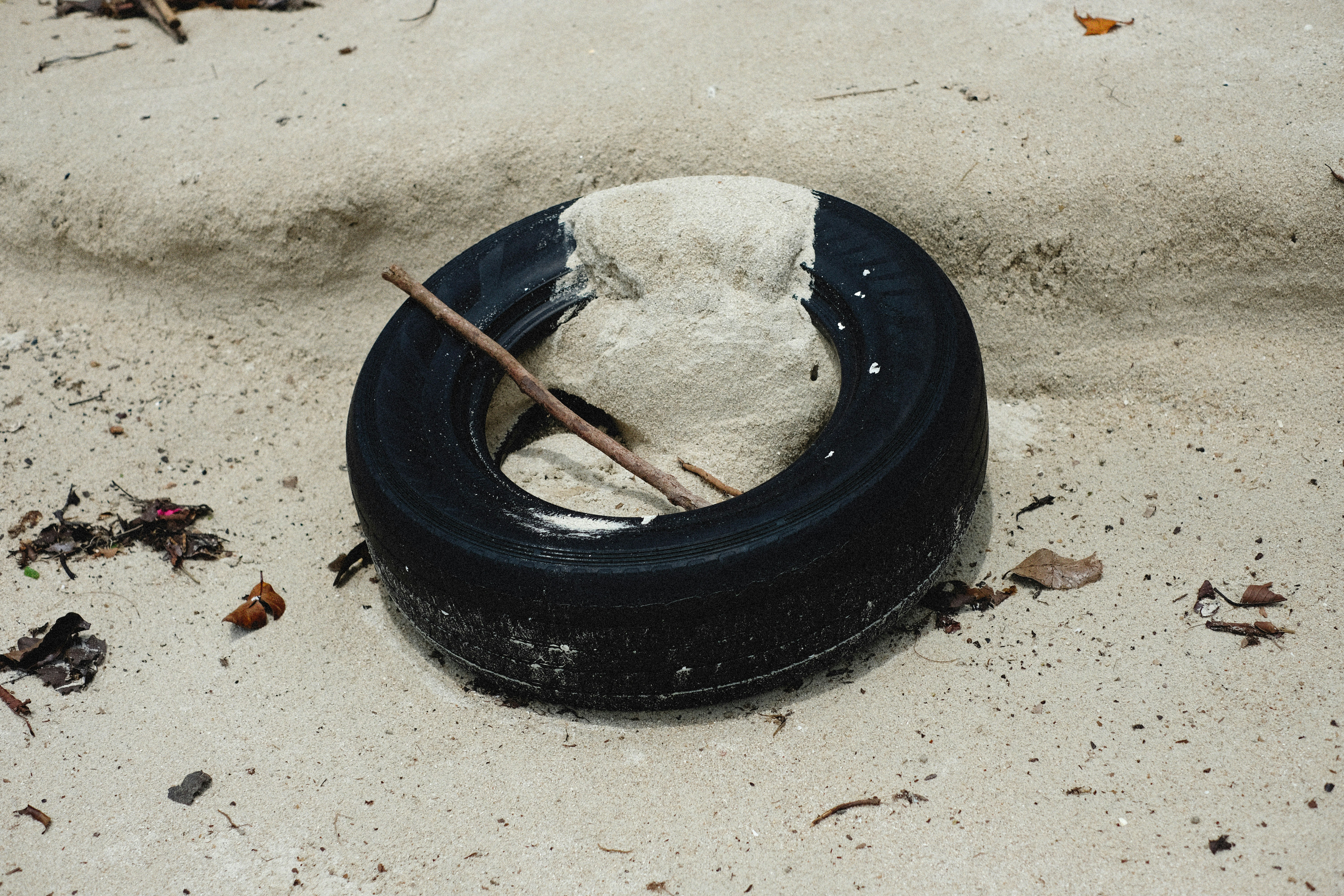 a tire with a stick sticking out of it