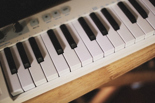 a close up of a piano keyboard on a table