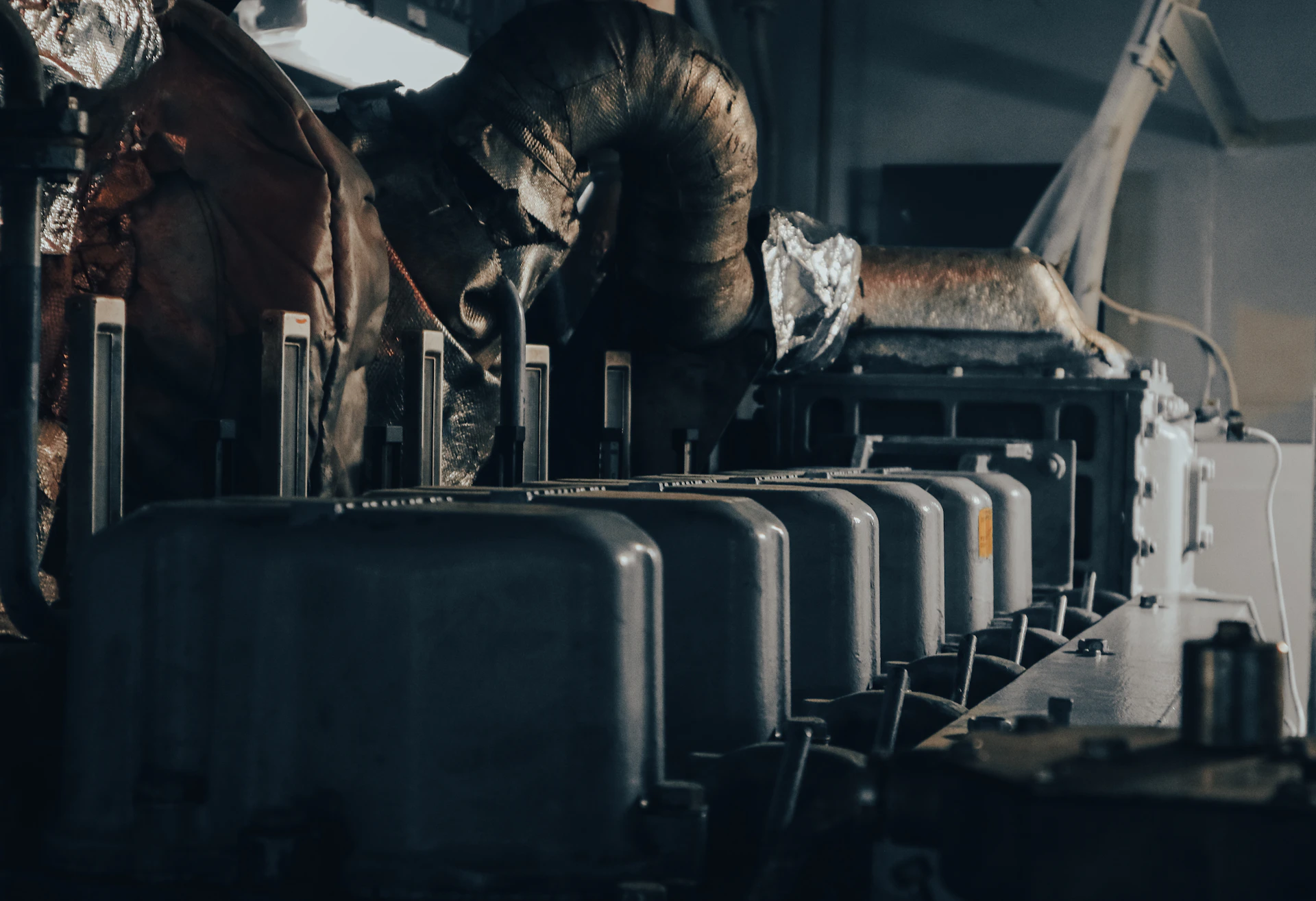 a man working on a machine in a factory