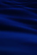 a blurry photo of a blue ocean with waves