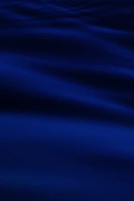 a blurry photo of a blue ocean with waves