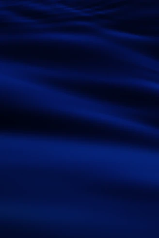a blurry photo of a blue ocean with waves