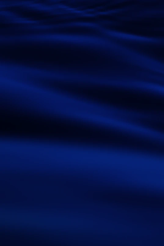 a blurry photo of a blue ocean with waves