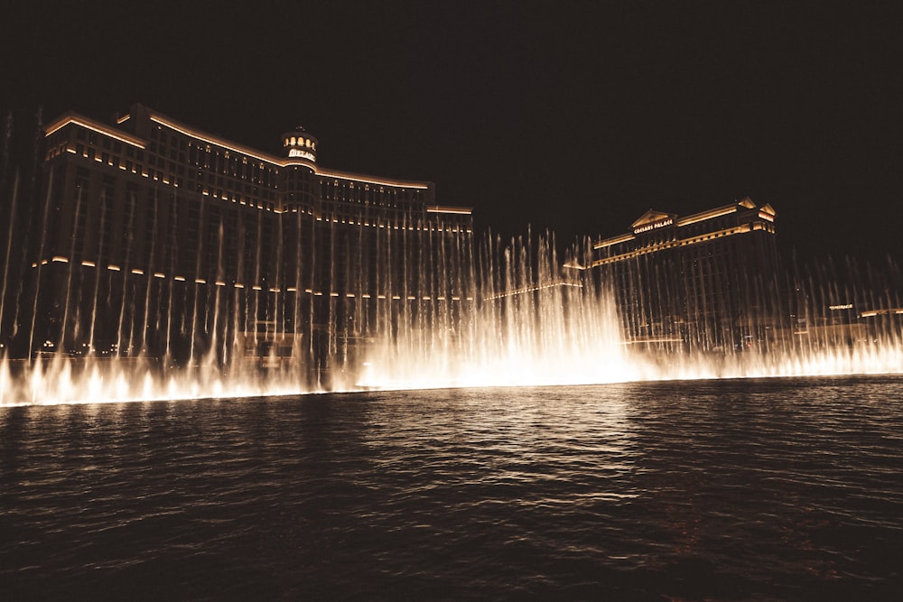 a large fountain in the middle of a body of water
