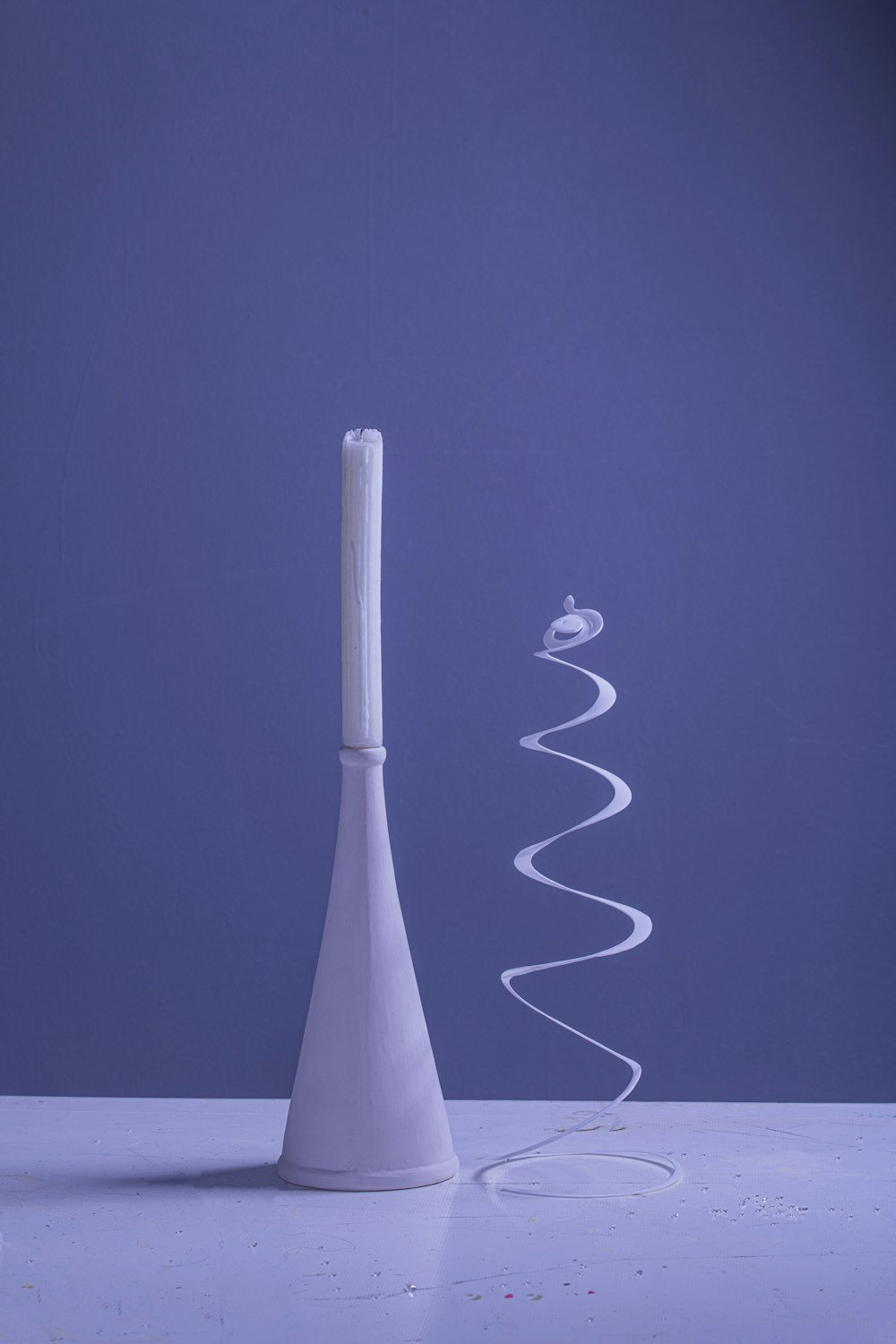 a tall white object sitting on top of a table