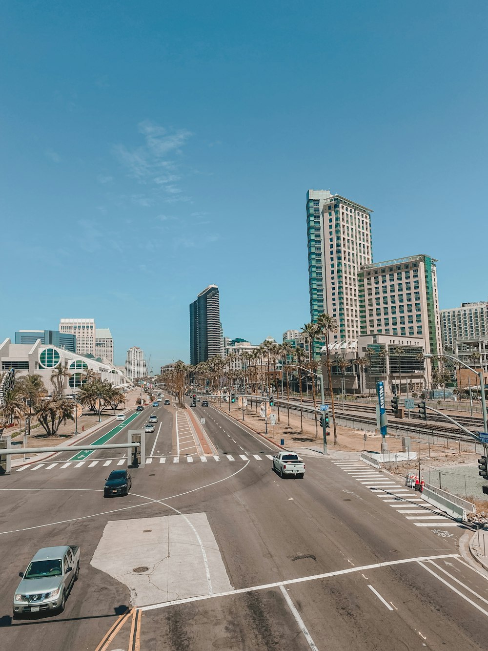 a city street with a few cars driving on it