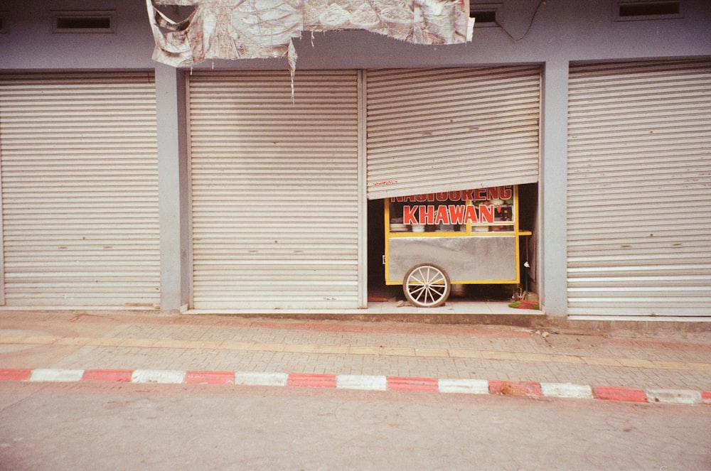 a car parked in front of a closed garage