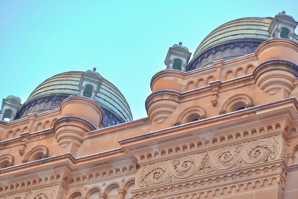 the top of a building with a sky background