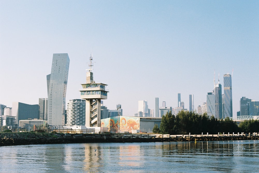 a body of water with a city in the background