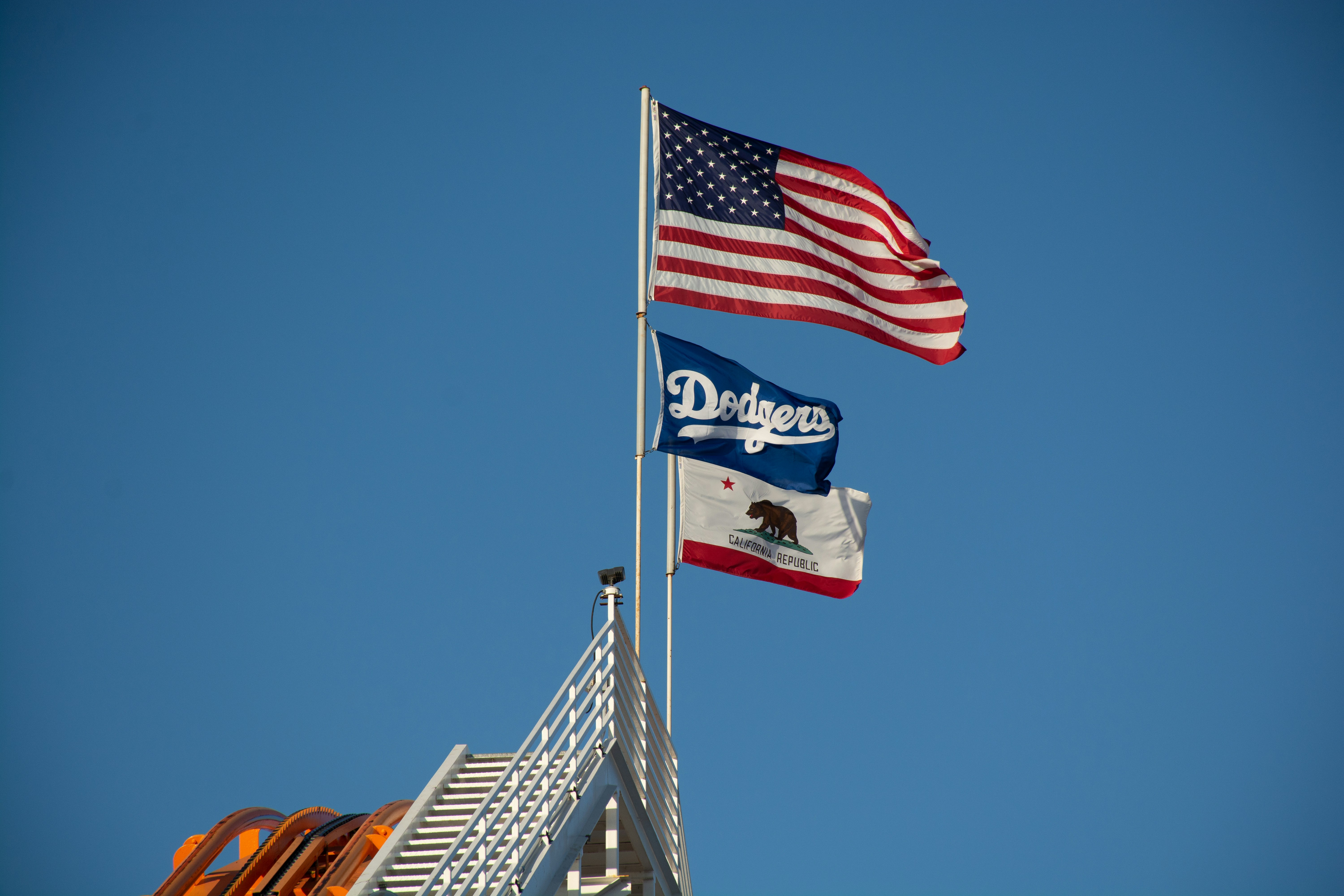 a couple of flags flying next to each other