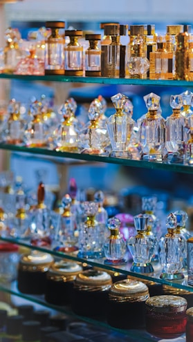 An array of vibrant floral perfume bottles.