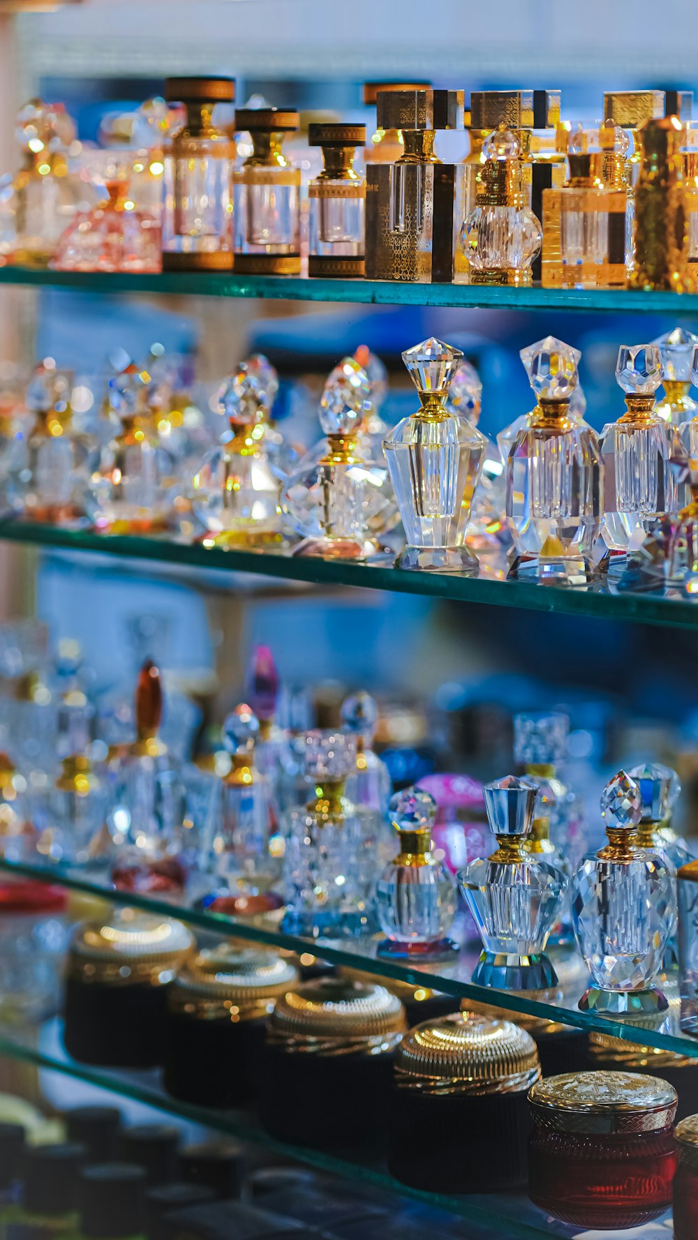 a display case filled with lots of different types of perfume bottles