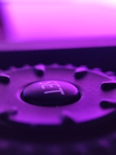 a close up of a purple gear wheel