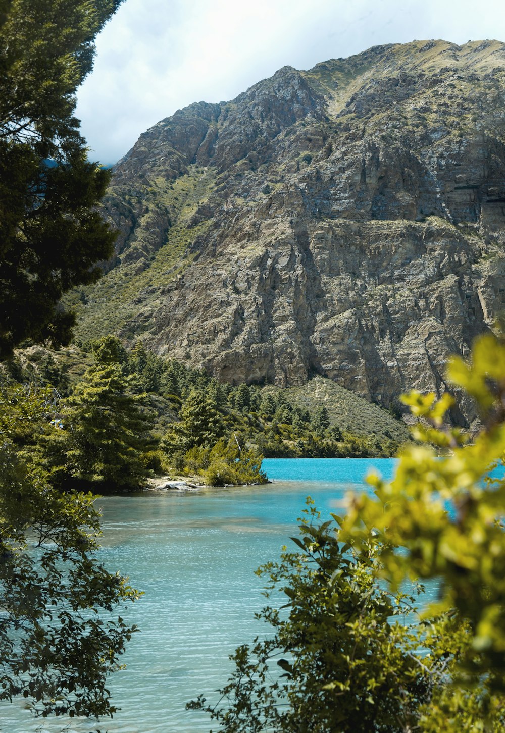 a lake surrounded by mountains and trees