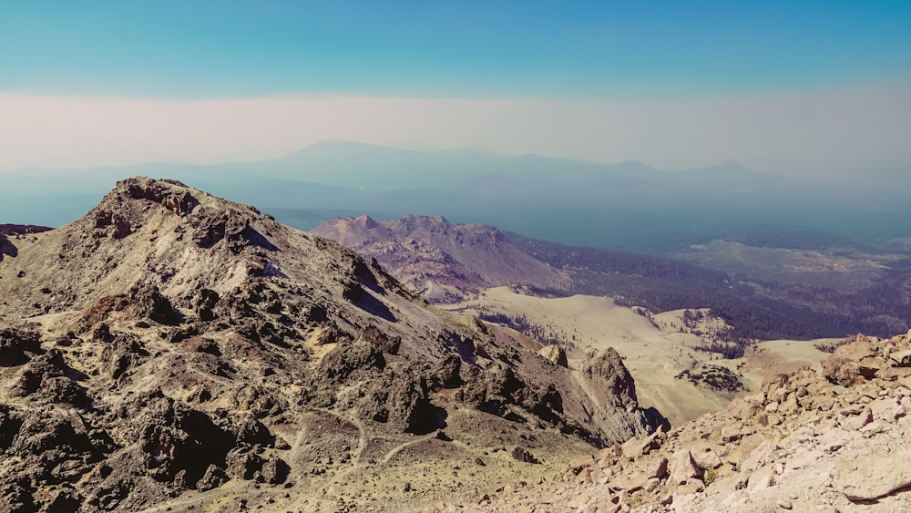 a view of a mountain range from the top of a mountain