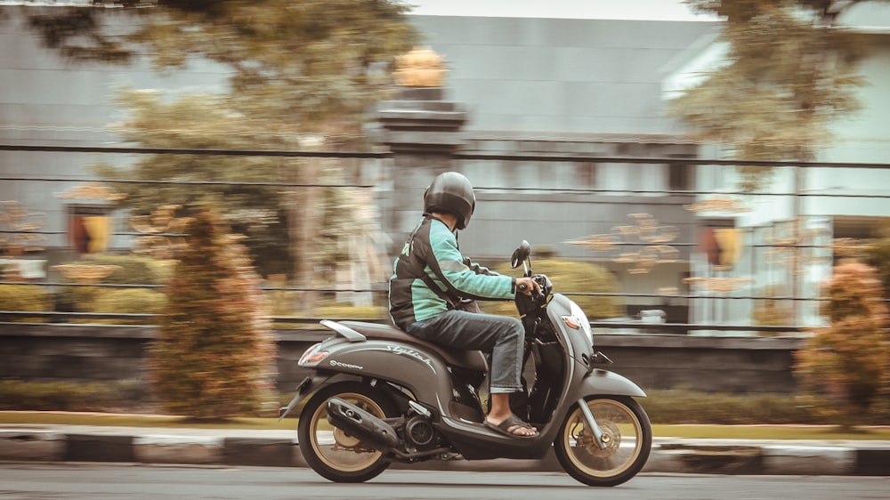 a person riding a motorcycle on a city street