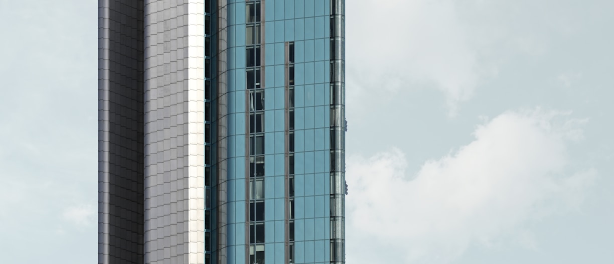 a tall building with a sky background