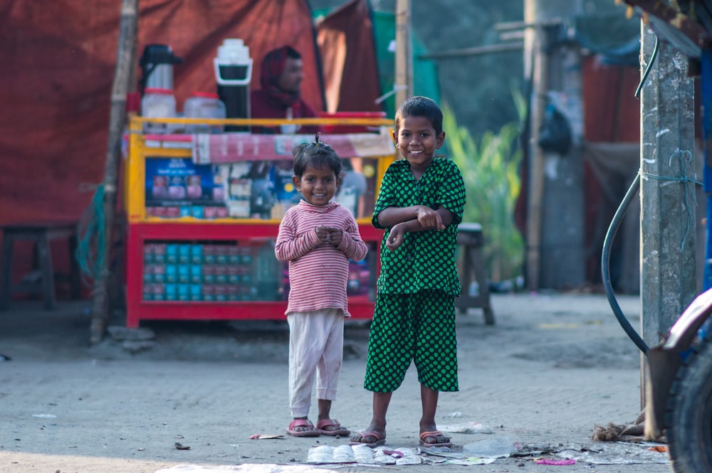 two little girls standing next to each other