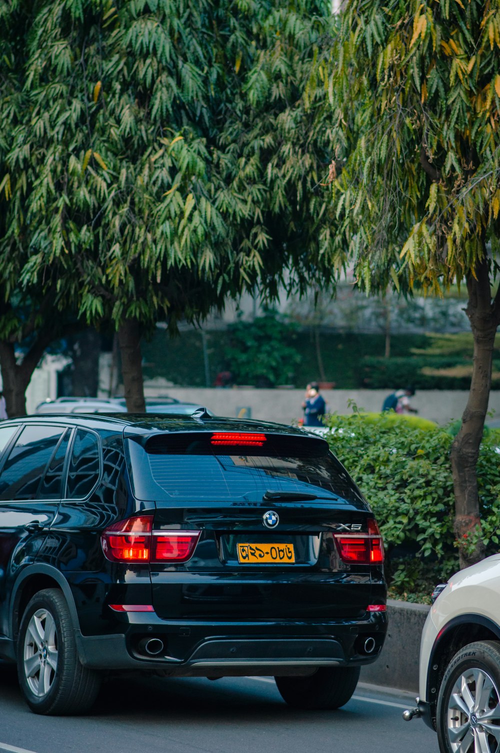 a couple of cars that are sitting in the street