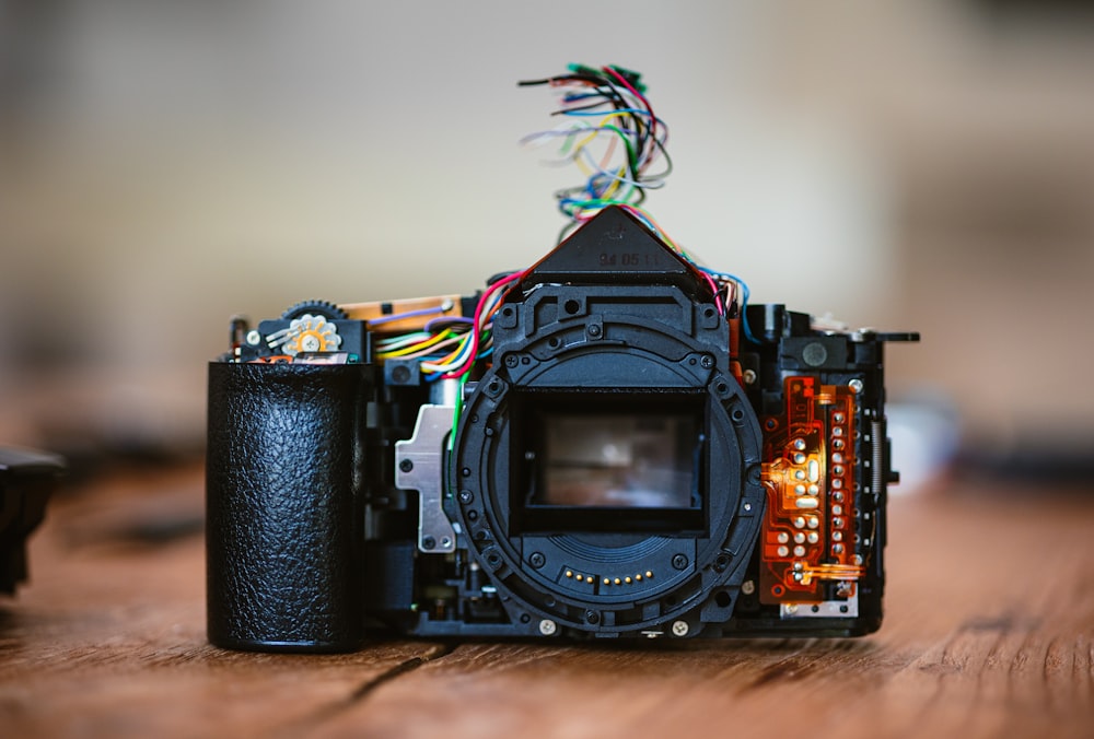 a camera sitting on top of a wooden table