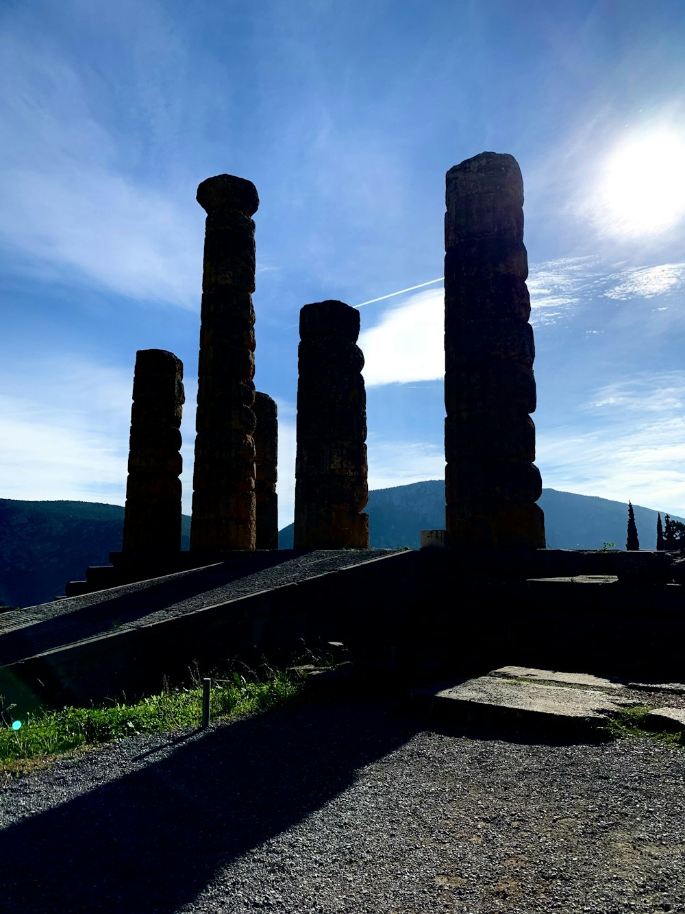 the sun shines on the ruins of the ancient city