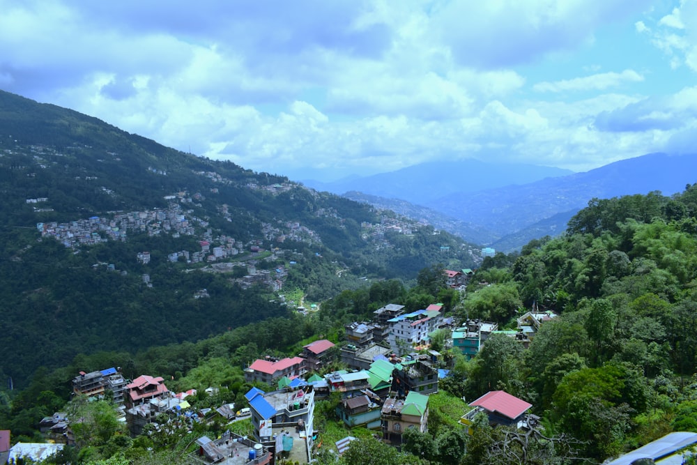 a view of a village in the mountains