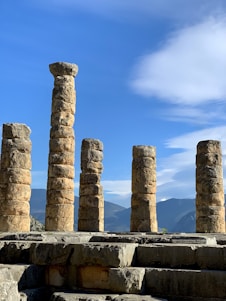 a row of stone pillars sitting next to each other