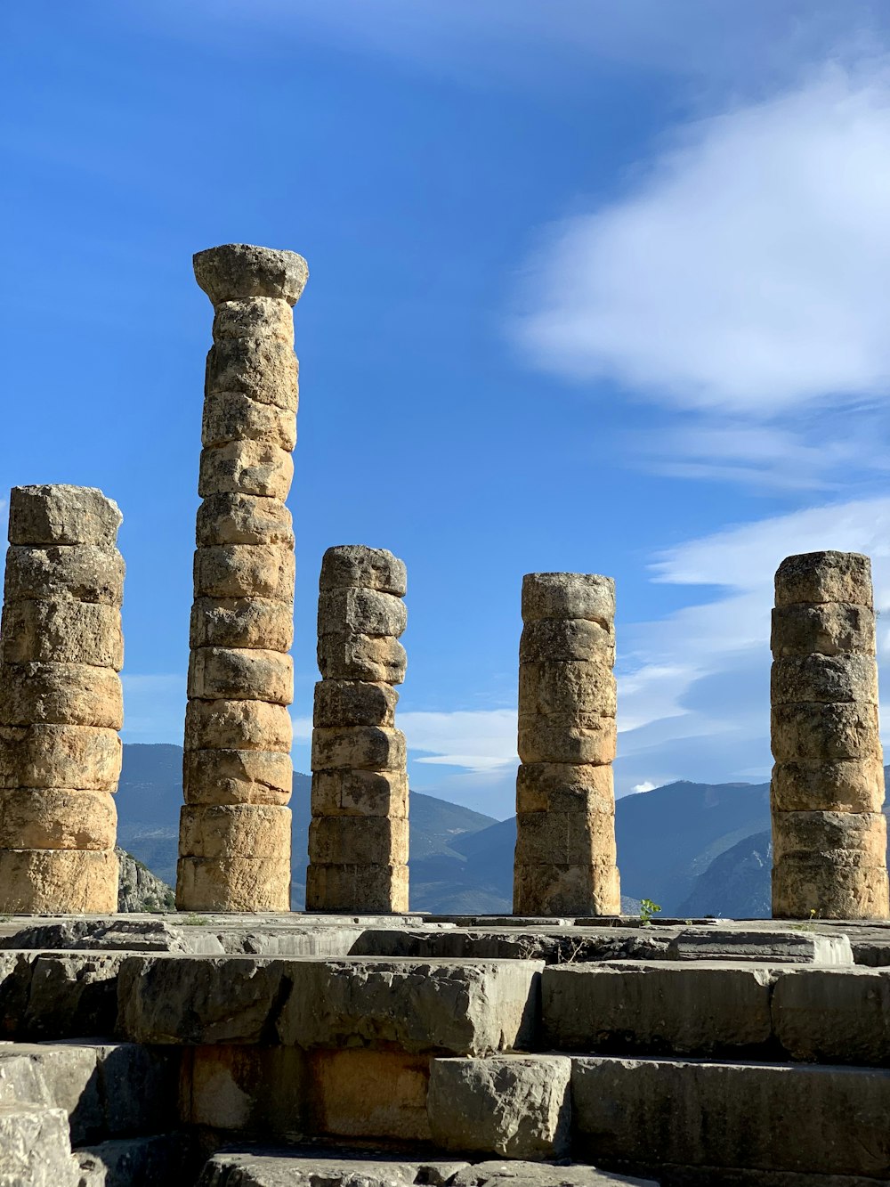 a row of stone pillars sitting next to each other