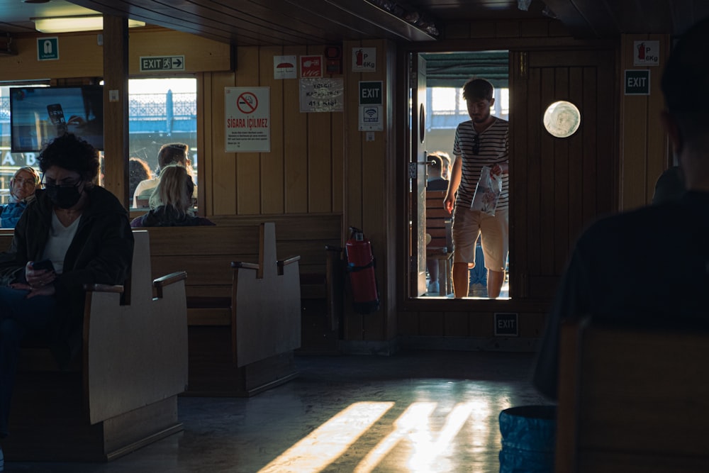 a group of people standing in front of a restaurant