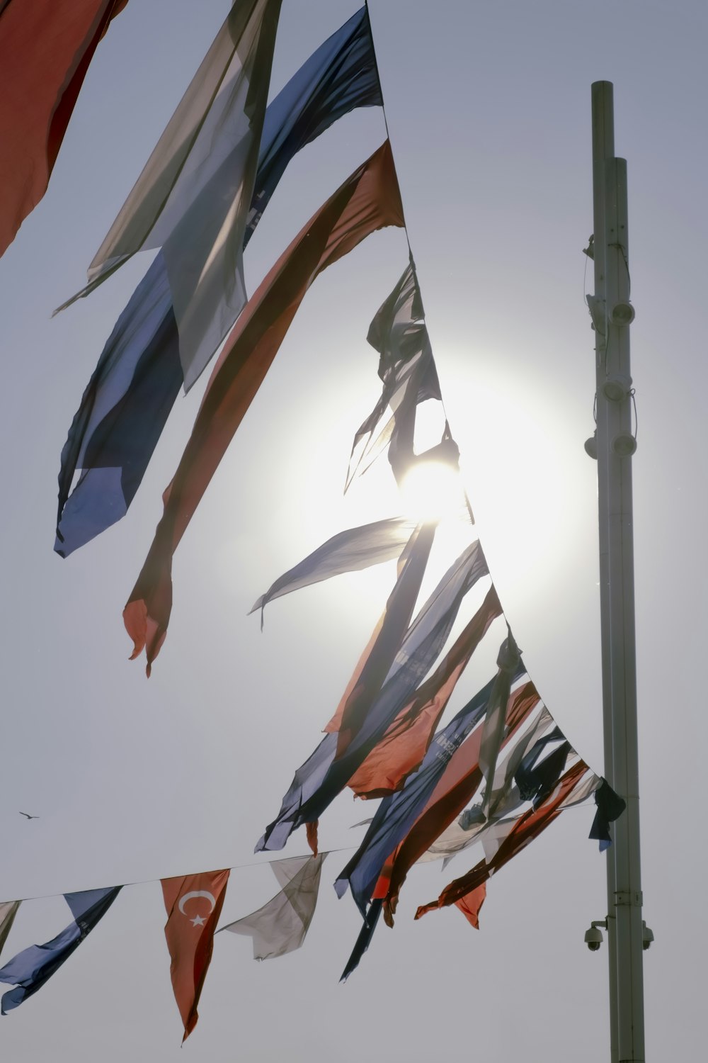 a bunch of flags that are flying in the air