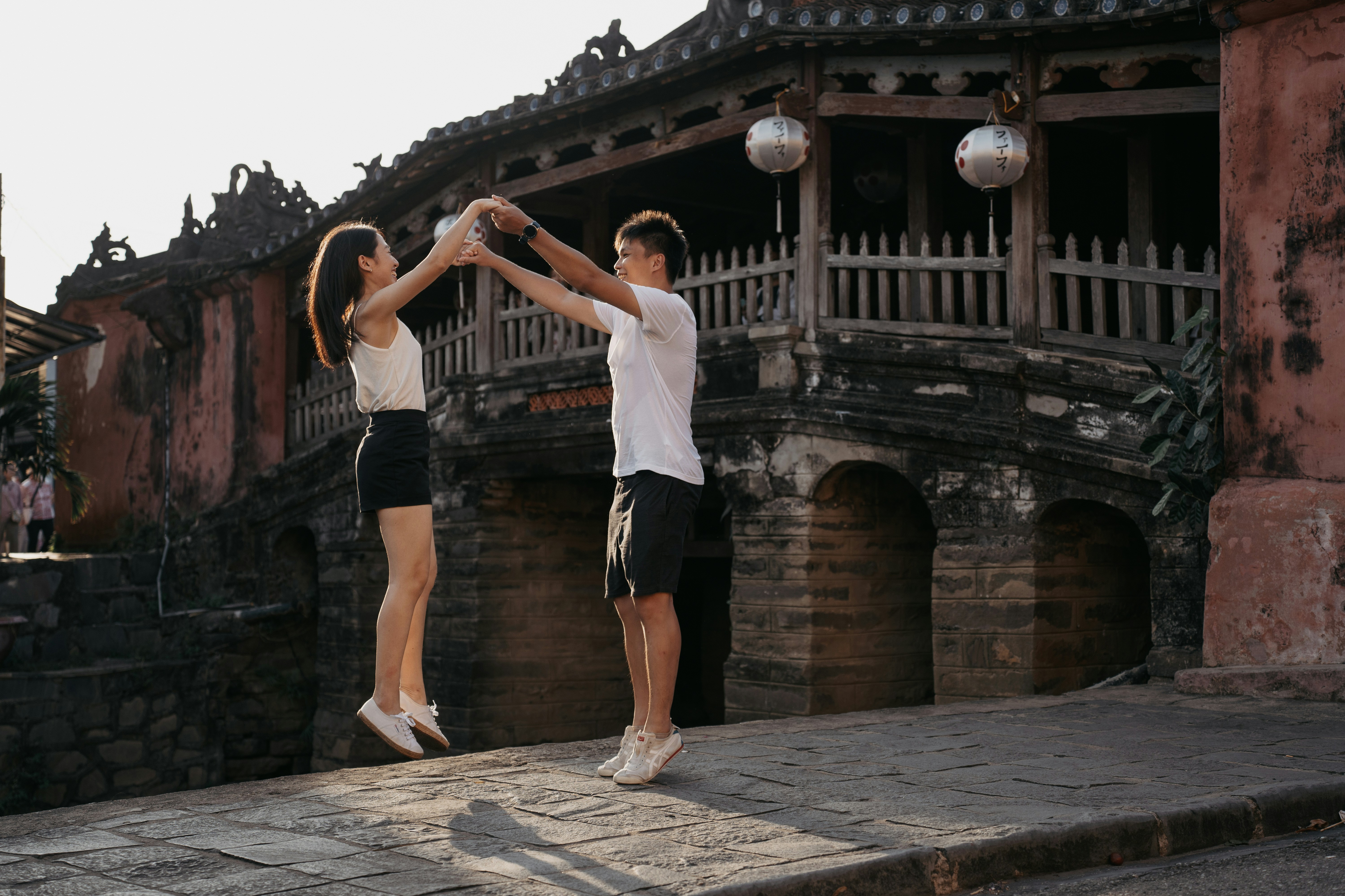 a couple of people that are standing in the street
