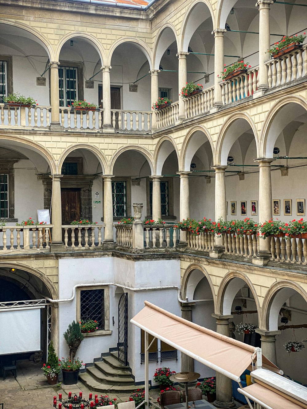 a large building with a bunch of flowers on the balconies