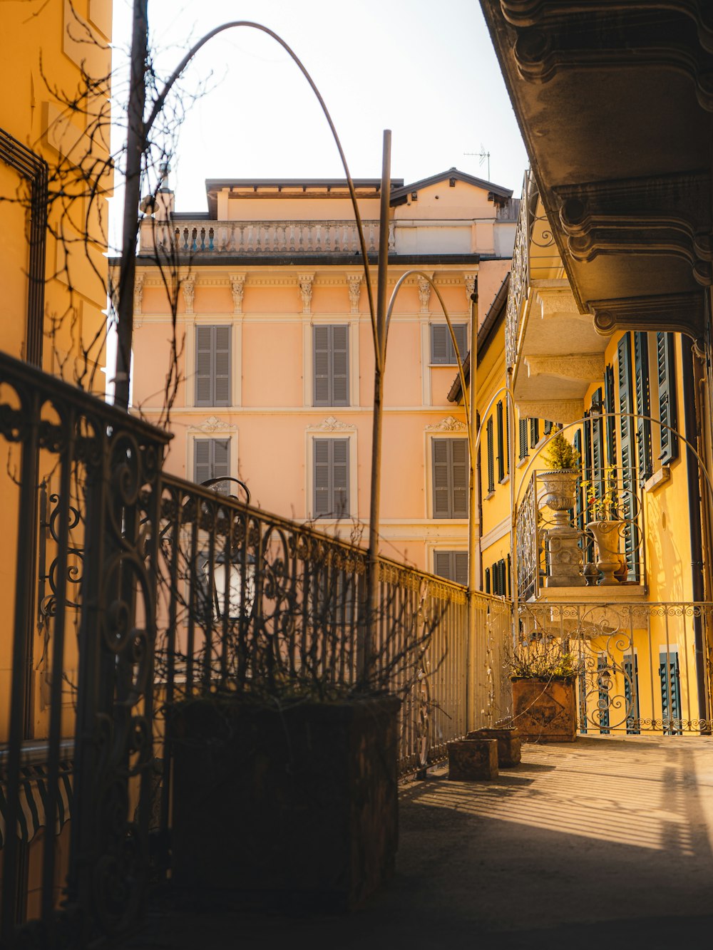 a yellow building with a clock on the side of it