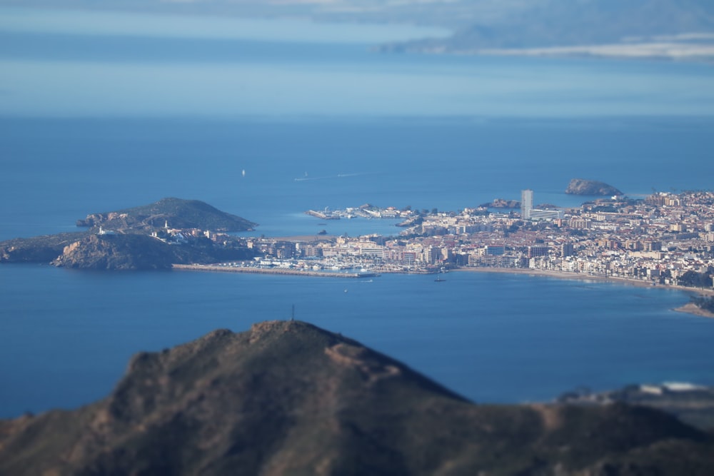 an aerial view of a city and a body of water