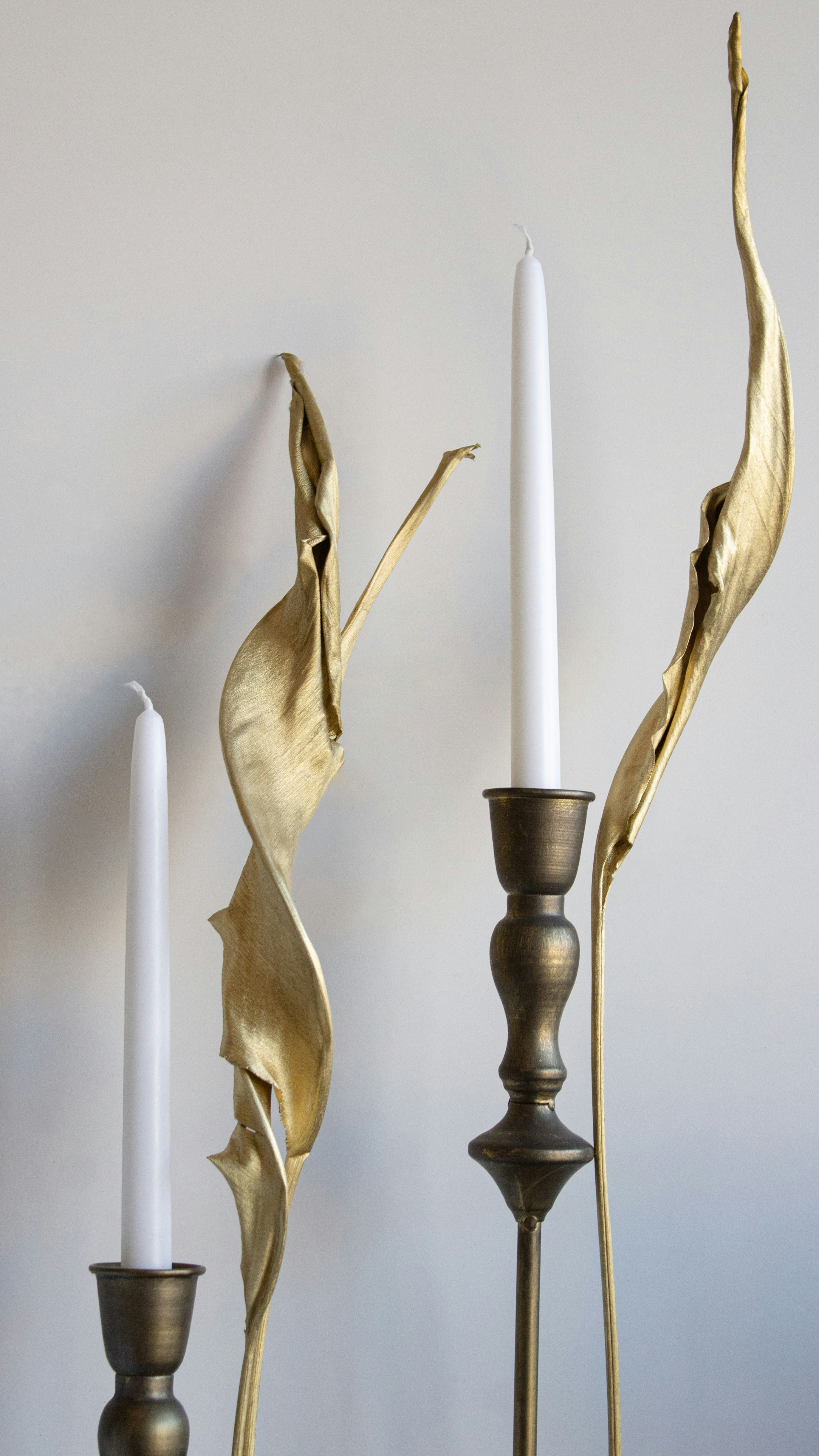 a couple of candles that are next to each other